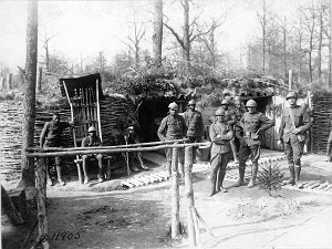 Group of Servicemen near encampment structure